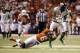 Dec 30, 2013; San Antonio, TX, USA; Oregon Ducks wide receiver Josh Huff (1) is tackled by Texas Longhorns corner back Quandre Diggs (6) during the first half at Alamo Dome. Mandatory Credit: Soobum Im-USA TODAY Sports