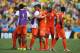 FORTALEZA, BRAZIL - JUNE 29: Klaas-Jan Huntelaar #19 of the Netherlands celebrates with team mates after defeating Mexico 2-1 during the 2014 FIFA World Cup Brazil Round of 16 match between Netherlands and Mexico at Castelao on June 29, 2014 in Fortaleza