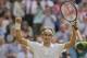 Jul 4, 2014; London, United Kingdom; Roger Federer (SUI) celebrates recording match point in his match against Milos Raonic (CAN) on day 11 of the 2014 Wimbledon Championships at the All England Lawn and Tennis Club. Mandatory Credit: Susan Mullane-USA TO