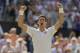 Jul 4, 2014; London, United Kingdom; Novak Djokovic (SRB) celebrates recording match point in his match against Grigor Dimitrov (BUL) on day 11 of the 2014 Wimbledon Championships at the All England Lawn and Tennis Club. Mandatory Credit: Susan Mullane-US