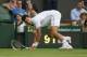 Jun 23, 2014; London, United Kingdom; Novak Djokovic (SRB) slips on the grass during his match against Andrey Golubev (KAZ) on day one of the 2014 Wimbledon Championships at the All England Lawn and Tennis Club. Mandatory Credit: Susan Mullane-USA TODAY S