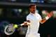 LONDON, ENGLAND - JULY 04: Novak Djokovic of Serbia plays a forehand return during his Gentlemen's Singles semi-final match against Grigor Dimitrov of Bulgaria on day eleven of the Wimbledon Lawn Tennis Championships at the All England Lawn Tennis and Cr