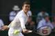Jul 4, 2014; London, United Kingdom; Milos Raonic (CAN) in action during his match against Roger Federer (SUI) on day 11 of the 2014 Wimbledon Championships at the All England Lawn and Tennis Club. Mandatory Credit: Susan Mullane-USA TODAY Sports
