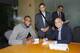 SACRAMENTO, CA - SEPTEMBER 30: Demarcus Cousins, Vivek Ranadive', and Pete D'Alessandro pose for a photo as The Sacramento Kings sign Demarcus to a contract extension on September 30, 2013 at the Kings practice facility in Sacramento, California. NOTE TO