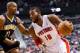 Mar 15, 2014; Auburn Hills, MI, USA; Detroit Pistons forward Greg Monroe (10) dribbles around Indiana Pacers format David West (21) at The Palace of Auburn Hills. Mandatory Credit: Rick Osentoski-USA TODAY Sports