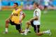 BELO HORIZONTE, BRAZIL - JULY 07: Toni Kroos (R) of Germany stretches during the German national team training at Estadio Mineirao on July 7, 2014 in Belo Horizonte, Brazil. (Photo by Martin Rose/Getty Images)
