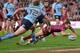 BRISBANE, AUSTRALIA - JULY 09: Billy Slater of the Maroons scores a try during game three of the State of Origin series between the Queensland Maroons and the New South Wales Blues at Suncorp Stadium on July 9, 2014 in Brisbane, Australia. (Photo by Brad