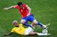 BELO HORIZONTE, BRAZIL - JUNE 28: Dani Alves of Brazil tackles Eugenio Mena of Chile during the 2014 FIFA World Cup Brazil round of 16 match between Brazil and Chile at Estadio Mineirao on June 28, 2014 in Belo Horizonte, Brazil. (Photo by Ian Walton/Get