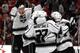 CHICAGO, IL - JUNE 01: Tyler Toffoli #73 of the Los Angeles Kings jumps on Alec Martinez #27 and teammates after Martinez scored the game winning goal against Corey Crawford #50 of the Chicago Blackhawks in overtime 5 to 4 to win Game Seven of the Wester