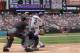 DENVER, CO - JUNE 21: Troy Tulowitzki #2 of the Colorado Rockies breaks his bat as he line out to secondbaseman Rickie Weeks #23 of the Milwaukee Brewers in the first inning as catcher Jonathan Lucroy #20 of the Milwaukee Brewers backs up the plate and u