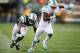 EAST RUTHERFORD, NJ - DECEMBER 01: Mike Wallace #11 of the Miami Dolphins scores a touchdown on the missed tackle by Dee Milliner #27 of the New York Jets in the fourth quarter during their game at MetLife Stadium on December 1, 2013 in East Rutherford,
