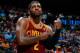 ATLANTA, GA - APRIL 04: Kyrie Irving #2 of the Cleveland Cavaliers grabs his arm after falling out of bounds with the ball against the Atlanta Hawks at Philips Arena on April 4, 2014 in Atlanta, Georgia. NOTE TO USER: User expressly acknowledges and agr