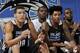 ORLANDO, FL - JULY 11: Aaron Gordon #00 and Elfrid Payton #4 of the Orlando Magic watch from the sideline during a game against the Detroit Pistons on July 11, 2014 at Amway Center in Orlando, Florida. NOTE TO USER: User expressly acknowledges and agrees