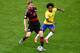 BELO HORIZONTE, BRAZIL - JULY 08: Per Mertesacker of Germany controls the ball as Willian of Brazil gives chase during the 2014 FIFA World Cup Brazil Semi Final match between Brazil and Germany at Estadio Mineirao on July 8, 2014 in Belo Horizonte, Brazi