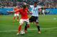 SAO PAULO, BRAZIL - JULY 09: Daryl Janmaat of the Netherlands controls the ball against Marcos Rojo of Argentina during the 2014 FIFA World Cup Brazil Semi Final match between the Netherlands and Argentina at Arena de Sao Paulo on July 9, 2014 in Sao Paul