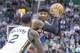 Mar 31, 2014; Salt Lake City, UT, USA; Utah Jazz forward Marvin Williams (2) defends against New York Knicks forward Carmelo Anthony (7) during the first half at EnergySolutions Arena. Mandatory Credit: Russ Isabella-USA TODAY Sports