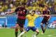 BELO HORIZONTE, BRAZIL - JULY 08: Bernard of Brazil is challenged by Sami Khedira of Germany during the 2014 FIFA World Cup Brazil Semi Final match between Brazil and Germany at Estadio Mineirao on July 8, 2014 in Belo Horizonte, Brazil. (Photo by Laure