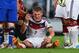 RIO DE JANEIRO, BRAZIL - JULY 13: Bastian Schweinsteiger of Germany receives treatment after a collision during the 2014 FIFA World Cup Brazil Final match between Germany and Argentina at Maracana on July 13, 2014 in Rio de Janeiro, Brazil. (Photo by Mat
