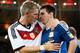 RIO DE JANEIRO, BRAZIL - JULY 13: Bastian Schweinsteiger of Germany hugs Lionel Messi of Argentina after Germany's 1-0 victory in extra time during the 2014 FIFA World Cup Brazil Final match between Germany and Argentina at Maracana on July 13, 2014 in