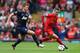 LIVERPOOL, ENGLAND - SEPTEMBER 01: Iago Aspas of Liverpool competes with Michael Carrick of Manchester United during the Barclays Premier League match between Liverpool and Manchester United at Anfield on September 01, 2013 in Liverpool, England. (Photo