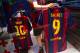 BARCELONA, SPAIN - JULY 12: An employee hangs a Luis Suarez shirt next to a Leo Messi shirt after printing his name and number on it at the FC Barcelona official store on July 12, 2014 in Barcelona, Spain. (Photo by David Ramos/Getty Images)