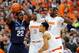 Dec 28, 2013; Syracuse, NY, USA; Villanova Wildcats forward JayVaughn Pinkston (22) looks to pass the ball around Syracuse Orange forward Jerami Grant (3) and center Baye Moussa Keita (12) and forward Michael Gbinije (0) during the first half at the Carri