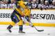 NASHVILLE, TN - MARCH 8: Michael Del Zotto #5 of the Nashville Predators shoots the puck against the Columbus Blue Jackets at Bridgestone Arena on March 8, 2014 in Nashville, Tennessee. (Photo by John Russell/NHLI via Getty Images)