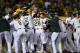 OAKLAND, CA - MAY 28: Josh Donaldson #20 of the Oakland Athletics is met at home plate by teammates after hitting a three-run walk-off homer to defeat the Detroit Tigers 3-1 at O.co Coliseum on May 28, 2014 in Oakland, California. (Photo by Thearon W. H
