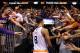 PHOENIX, AZ - APRIL 14: Fans reach for Channing Frye #8 of the Phoenix Suns as he walks off the court following the NBA game against the Memphis Grizzlies at US Airways Center on April 14, 2014 in Phoenix, Arizona. The Grizzlies defeated the 97-91. NOT