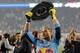 Oct 27, 2013; Harrison, NJ, USA; New York Red Bulls goalkeeper Luis Robles (31) celebrates with the Supporters' Shield after a game against the Chicago Fire at Red Bull Arena. The Red Bulls defeated the Fire 5-2. Mandatory Credit: Brad Penner-USA TODAY Sp