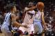 Mar 21, 2014; Miami, FL, USA; Miami Heat guard Dwyane Wade (3) looks to pass the ball as Memphis Grizzlies guard Courtney Lee (5) defends in the second half at American Airlines Arena. The Heat won 91-88. Mandatory Credit: Robert Mayer-USA TODAY Sports