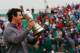 HOYLAKE, ENGLAND - JULY 20: Rory McIlroy of Northern Ireland holds the Claret Jug aloft after his two-stroke victory at The 143rd Open Championship at Royal Liverpool on July 20, 2014 in Hoylake, England. (Photo by Tom Pennington/Getty Images)