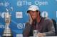 HOYLAKE, ENGLAND - JULY 20: Rory McIlroy of Northern Ireland answers questions from the media after his two-stroke victory at The 143rd Open Championship at Royal Liverpool on July 20, 2014 in Hoylake, England. (Photo by Andrew Redington/Getty Images)