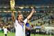July 13, 2014; Rio de Janeiro, BRAZIL; Germany midfielder Mario Gotze (19) celebrates with the world cup trophy after the championship match of the 2014 World Cup against the Argentina at Maracana Stadium. Germany won 1-0. Mandatory Credit: Tim Groothuis