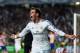 LISBON, PORTUGAL - MAY 24: Gareth Bale of Real Madrid celebrates scoring their second goal in extra time during the UEFA Champions League Final between Real Madrid and Atletico de Madrid at Estadio da Luz on May 24, 2014 in Lisbon, Portugal. (Photo by S