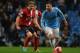 MANCHESTER, ENGLAND - JANUARY 15: Javi Garcia of Manchester City competes with Chris Taylor of Blackburn Rovers during the Budweiser FA Cup Third Round Replay match between Manchester City and Blackburn Rovers at the Etihad Stadium on January 15, 2014 in