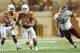 AUSTIN, TX - AUGUST 31: David Ash #14 of the Texas Longhorns breaks free from the New Mexico State Aggies on August 31, 2013 at Darrell K Royal-Texas Memorial Stadium in Austin, Texas. (Photo by Cooper Neill/Getty Images)