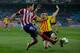 MADRID, SPAIN - DECEMBER 18: Javier Manquillo (L) of Atletico de Madrid competes for the ball with Alberto Rodriguez Carroza (R) during the Copa del Rey Round of 32 second leg match between Club Atletico de Madrid and Sant Andreu at Vivente Calderon Stadi