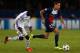 PARIS, FRANCE - NOVEMBER 05: Gregory van der Wiel of PSG is chased by Fabrice N'Sakala of Anderlecht during the UEFA Champions League Group C match between Paris Saint Germain and RSC Anderlecht at Parc des Princes on November 5, 2013 in Paris, France. (