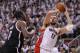 TORONTO, ON - MAY 04: Jonas Valanciunas #17 of the Toronto Raptors tries to make a shot over Andray Blatche #0 of the Brooklyn Nets in Game Seven of the NBA Eastern Conference Quarterfinals at the Air Canada Centre on May 4, 2014 in Toronto, Ontario, Can