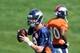 Jul 24, 2014; Dove Valley, CO, USA; Denver Broncos quarterback Peyton Manning (18) prepares to pass during training camp activities at the Broncos training facility. Mandatory Credit: Ron Chenoy-USA TODAY Sports