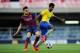 BARCELONA, SPAIN - MARCH 18: Gedion Zelalem of Arsenal duels for the ball with Munir El Haddadi of FC Barcelona during the UEFA Youth League Quarter FInal match between FC Barcelona U19 and Arsenal U19 at Mini Estadi on March 18, 2014 in Barcelona, Spain