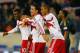 HARRISON, NJ - APRIL 16: Lloyd Sam #10 of the New York Red Bulls is mobbed by teammates Tim Cahill #17 and Roy Miller #7 after scoring in the 67th minute against the Philadelphia Union at Red Bull Arena on April 16, 2014 in Harrison, New Jersey. Red Bull