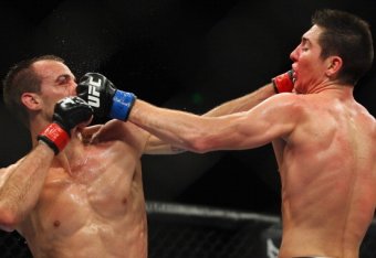 SYDNEY, AUSTRALIA - MARCH 03:  Cole Miller of the USA and Steven Siler of the USA exchange punches during the USC On FX featherweight bout between Cole Miller and Steven Siler at Allphones Arena on March 3, 2012 in Sydney, Australia.  (Photo by Mark Kolbe