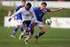 BURTON UPON TRENT, ENGLAND - MARCH 5: Jermaine Anderson (L) of England and Nikola Vlasic of Croatia battle for the ball during the U18 International friendly match between England and Croatia at St Georges Park on March 5, 2014 in Burton upon Trent, Engl