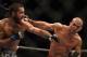 July 26, 2014; San Jose, CA, USA; Robbie Lawler (red gloves) punches Matt Brown (blue gloves) during the welterweight bout of the FOX UFC Saturday at SAP Center. Mandatory Credit: Kyle Terada-USA TODAY Sports