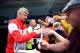 BOREHAMWOOD, ENGLAND - JULY 19: Arsenal manager Arsene Wenger signs autographs for fans as he arrives ahead of the pre season friendly match between Borehamwood and Arsenal at Meadow Park on July 19, 2014 in Borehamwood, England. (Photo by Jordan Mansfi