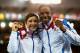 GLASGOW, SCOTLAND - JULY 28: Gold medalist Libby Clegg of Scotland and her guide Mikail Huggins on the podium during the medal ceremony for the Women's 100m T12 Finalat Hampden Park during day five of the Glasgow 2014 Commonwealth Games on July 28, 2014