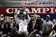 ATLANTA, GA - DECEMBER 31: Head coach Kevin Sumlin of the Texas A&M Aggies holds up the championship trophy following the Chick-fil-A Bowl against the against the Duke Blue Devils at the Georgia Dome on December 31, 2013 in Atlanta, Georgia. Texas A&M won
