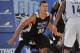 ORLANDO, FL - JULY 8: Aaron Gordon #00 of the Orlando Magic defends against against Kalin Lucas #14 of the Memphis Grizzlies during the game during the Samsung NBA Summer League 2014 on July 8, 2014 at Amway Center in Orlando, Florida. NOTE TO USER: User